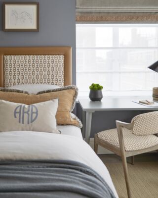The sons bedroom at our most recent Knightbridge square project. The headboard is a stand out upholstered in the Burlington fabric from our @andrewmartin_int collection. The chair is upholstered in the Bruton fabric from the same collection. The monogrammed cushion is from our @coze_linen collection, the carpet is @crucialtrading the handles are @armacmartin and the fringe on the bolster cushion is from @andrewmartin_int #kidsroom #kidsroomdecor #monogram #monogrameverything #luxinteriors 📷 @raymain57